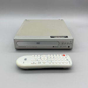 May include: A set of three ceramic mugs with a speckled, matte finish. The mugs are in shades of cream, light gray, and dark gray. Each mug has a simple, minimalist design and a rounded handle.