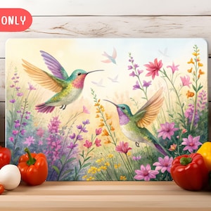 May include: Two colourful hummingbirds with green, blue and pink feathers are flying over a field of pink, purple and yellow flowers. The background is a soft yellow.