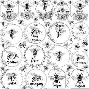 May include: A black and white sticker sheet featuring bee illustrations and related designs. The sheet includes bees, floral elements, and phrases such as "creative" and "unique." Honeycomb and sunflower designs are also present.