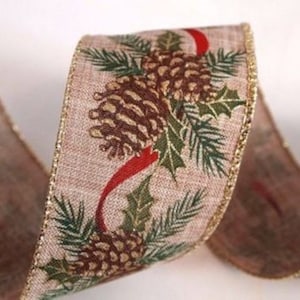 May include: Tan ribbon with a repeating pattern of pinecones, holly, and red accents. The ribbon's edges are trimmed with gold glitter, adding a festive touch. Ideal for holiday crafts and decorations.