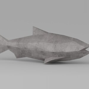 May include: A gray concrete fish sculpture with a geometric design. The sculpture is made of multiple triangular shapes and has a smooth, textured surface.