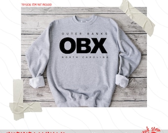 May include: A grey sweatshirt with black text that reads "Outer Banks OBX North Carolina".