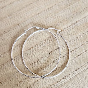 Silver hoops sparkly Partially textured earrings, skinny anti tarnish earrings, big 60m hoops