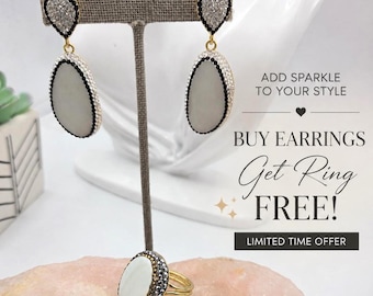 White dangle earrings and ring