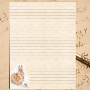 May include: A lined sheet of paper with a brown rabbit wearing a yellow bow and a small green mouse on the bottom right corner.