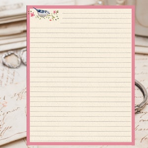May include: A lined sheet of paper with a pink border. The top of the paper features a small illustration of a blue bird perched on a branch with pink flowers.