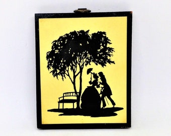 Arte vintage de silueta de pareja cortejando sobre madera