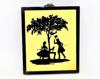 Arte vintage de silueta de pareja cortejando sobre madera