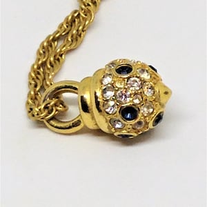 Nolan Miller Crystal Cabochon Pendant Necklace: Gold Rope Chain