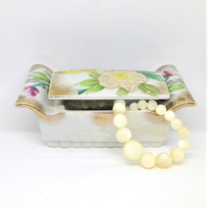 Tarro de porcelana vintage con diseño floral: joyero con pájaro y relieve de oro amarillo