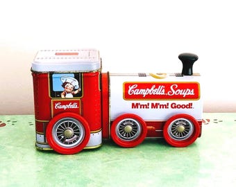 Lata vintage de Campbell con forma de tren y ruedas.
