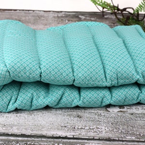 Reusable Rice Heating Pad. Microwave for Natural Heat Therapy or Freeze for Cooling Comfort. Providing Relaxation and Comfort.