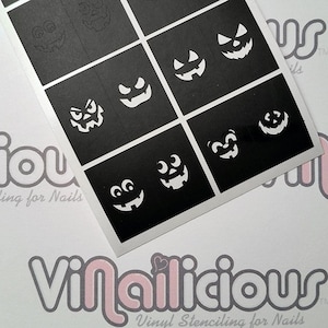 May include: Black and white stencil sheet with nine different pumpkin face designs. The stencil sheet is for nail art and is made by Vinailicious.