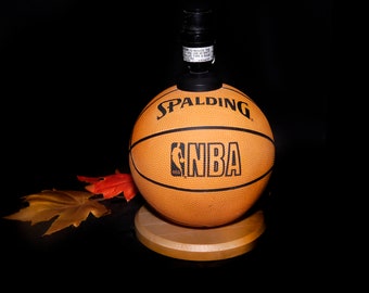 NBA Spalding official basketball table lamp. Mini Spalding ball with wooden base. No shade.