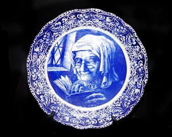 Boch Freres | Royal Boch La Louviere large hand-painted Delft wall display plate. Spectacled woman reading book.