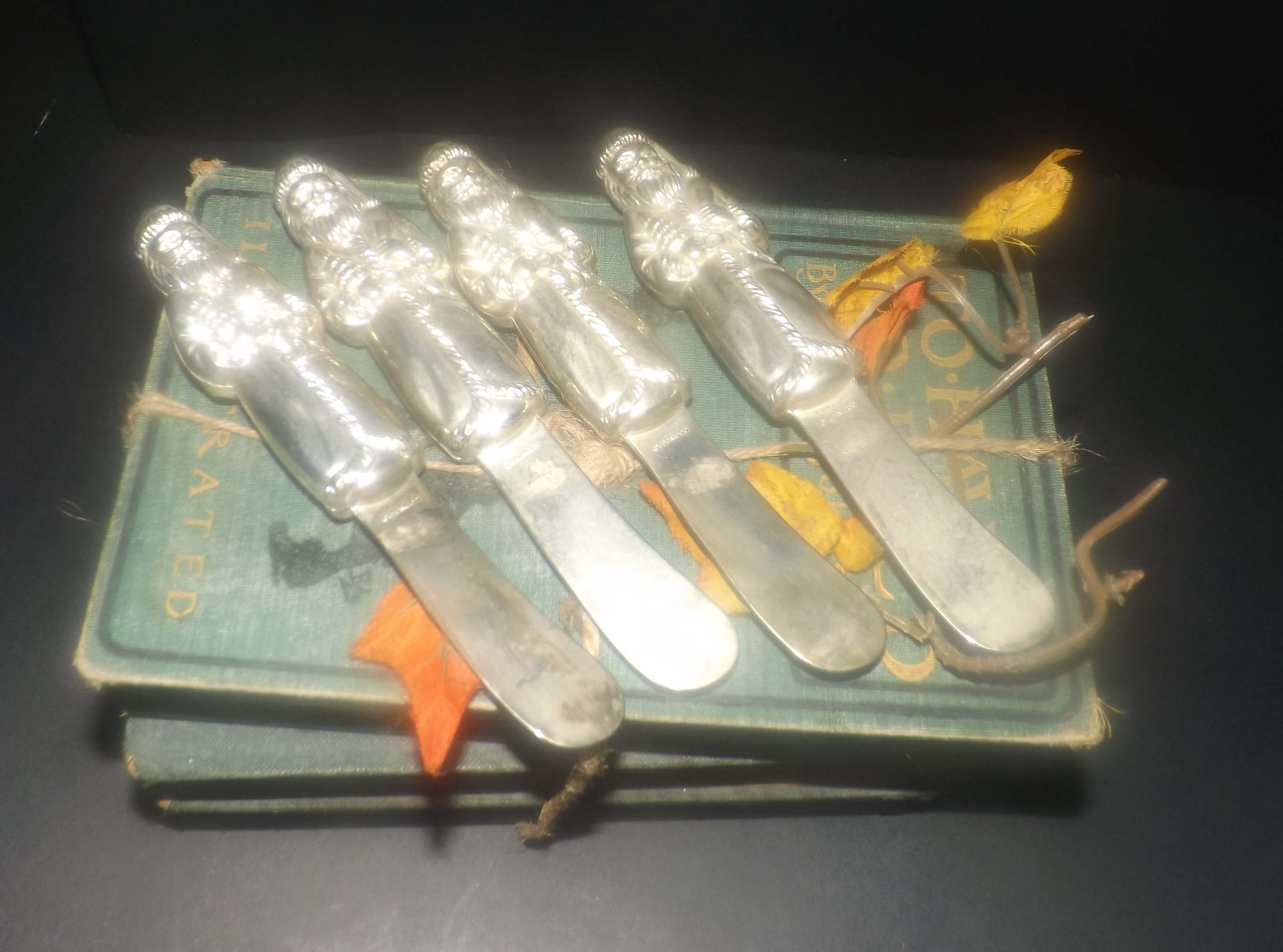 Set of four vintage (late 1980s) Godinger silverplated Santa butter