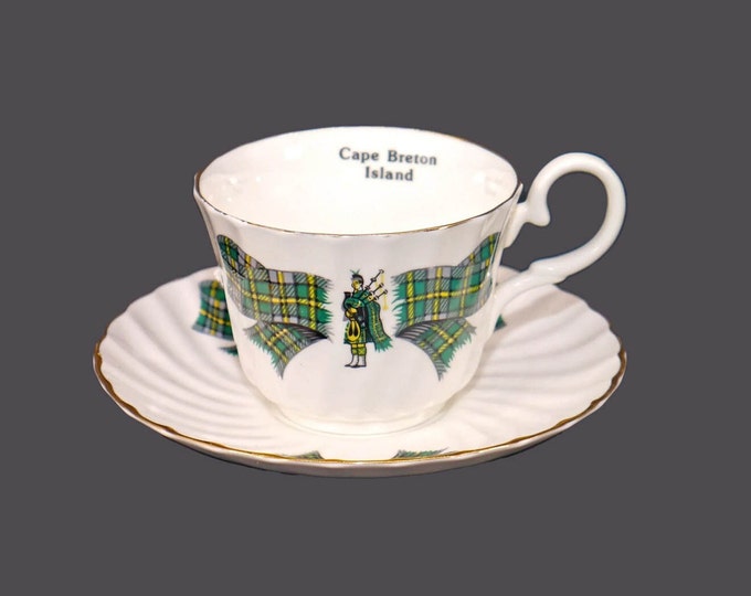 Royal Stuart | Spencer Stevenson Scottish tartan, bagpiper cup and saucer set. Bone china made in England. Souvenir of Cape Breton Island.