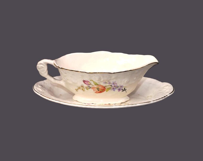 British Empire China Co. Haddon Hall Deluxe Embossed Ware gravy boat with oval under plate.
