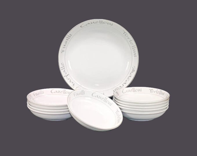 Eleven-piece pasta bowl set. One serving bowl, ten individual pasta bowls. Silver pasta wording on white.
