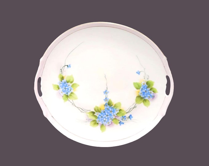 Antique hand-painted Nippon lugged cake or cookie serving plate. Handle cut-outs, pink band, blue flowers, greenery.