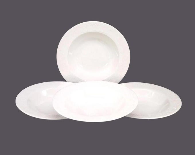 Four Sakura Devonshire White Chef's favorite all-white rimmed soup bowls.