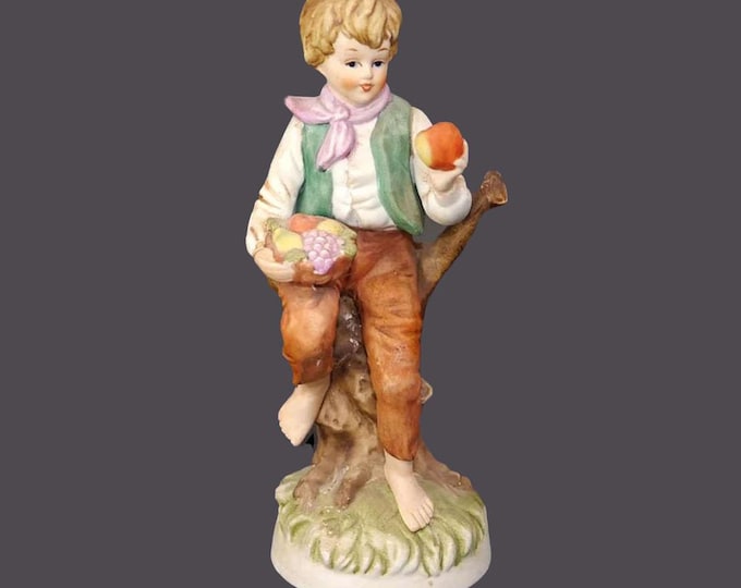 Giftcraft porcelain bisque figurine. Young boy holding fruit. Made in Japanese Taiwan. Flaws (see below).