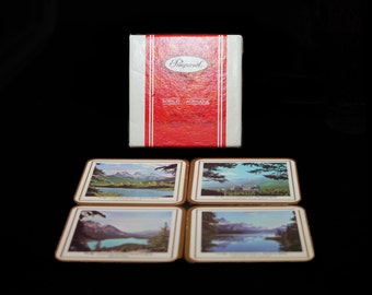 Four Pimpernel Canadian Rockies scenes acrylic cork-backed coasters made in England with original box.
