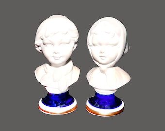 Pair of Capodimonte porcelain bisque busts. Girl in bonnet, boy in cap. Attributed to Italy manufacture Pucci.