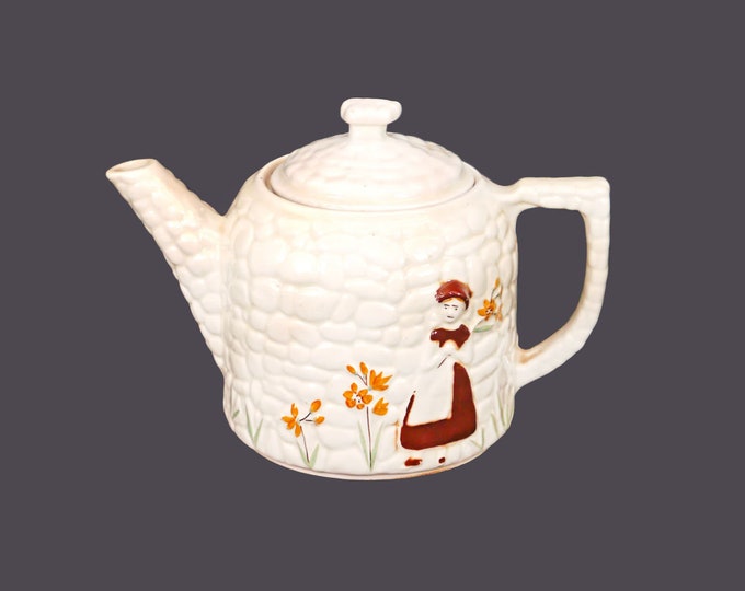 Porcelier Cobblestone 8-cup teapot | coffee pot made in USA. Girl against wall flowers. Uranium glazed. Flaws (see below).