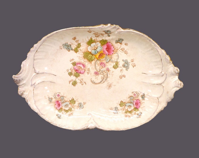 Antique late Victorian-era S. Fielding & Co. Elm lugged platter made in England.