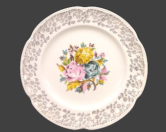 Sovereign Potters SVP31  dinner plate. Central flowers, gold filigree rim. English ironstone decorated in Canada. Sold individually
