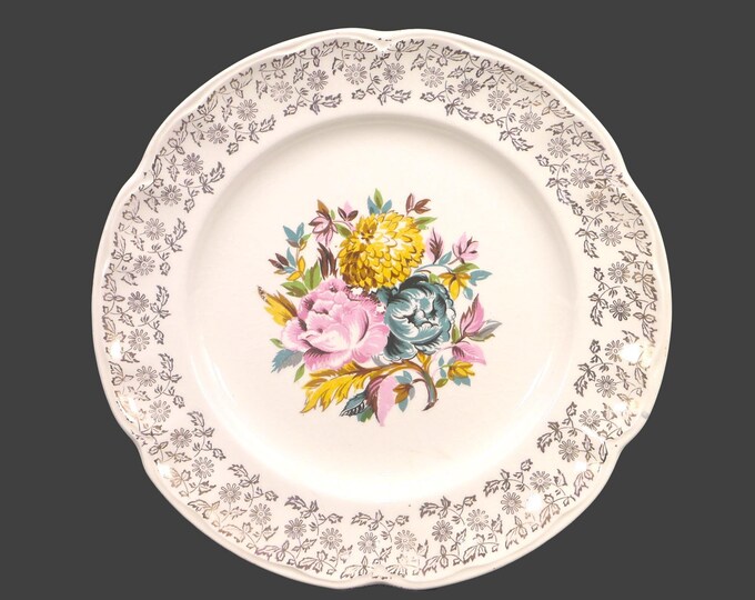 Sovereign Potters SVP31  dinner plate. Central flowers, gold filigree rim. English ironstone decorated in Canada. Sold individually