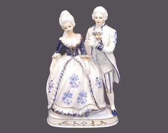Dresden-style Courting Couple figurine. Man woman in period Victorian dress. Attributed Taiwan 1960s. Minor flaw.