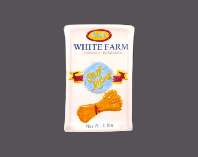 Boston Warehouse AAA White Farm Self-rising flour embossed, ceramic spoon rest. Flaws (see below).