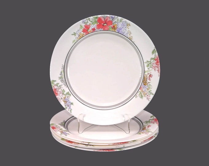 Six Arcopal glass dinner plates. Red, blue, yellow flowers, black and gray bands. Made in France.