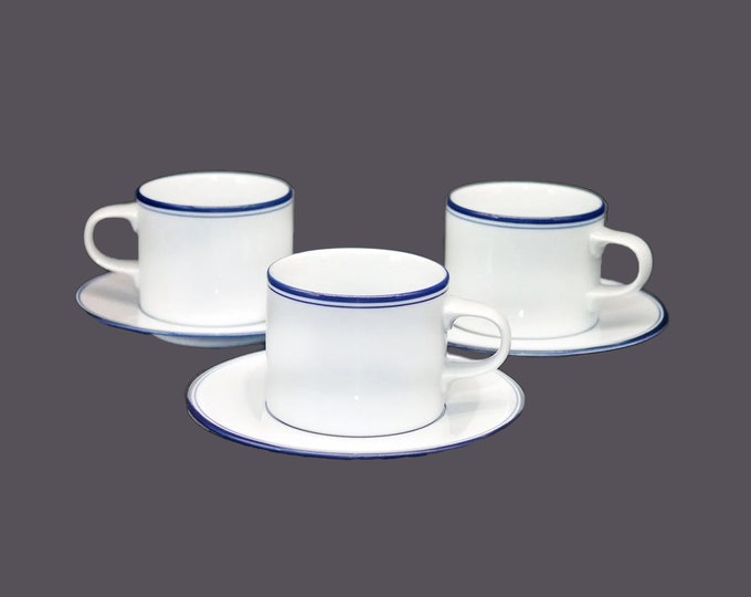 Three Dansk mismatched cup and saucer sets. Allegro Blue saucers, Indigo cups. Made Portugal and Japan. Flaw (see below).