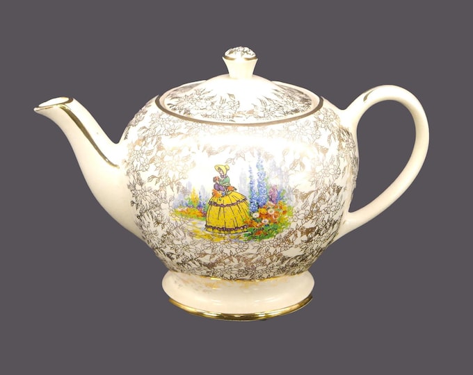 Sadler Crinoline Lady SAD7 four-cup teapot with lid. Gold chintz.