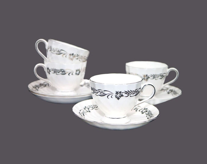 Four Tuscan China Silver Heritage cup and saucer sets made in England.