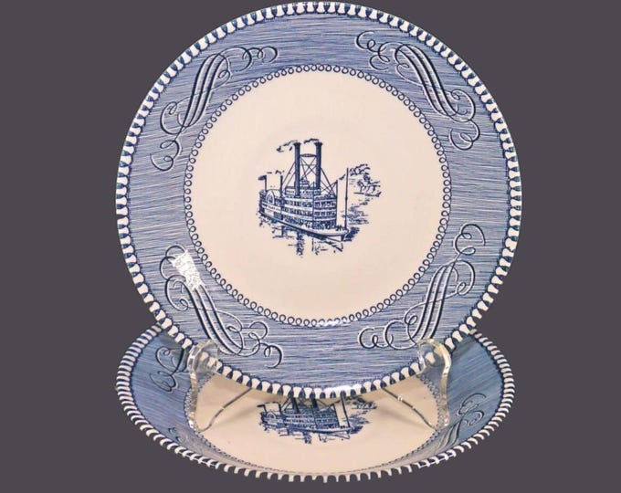 Pair of Royal China Currier & Ives Blue blue-and-white steampunk orphaned saucers made in USA. Flaw (see below).