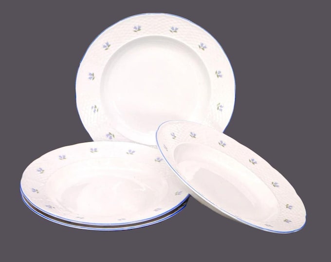 Four Belfor Blue Bell rimmed soup bowls made in Czechoslovakia for Birks.