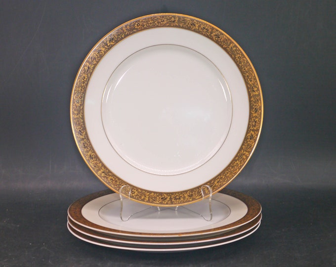 Four Sango Hampton 3758 large dinner plates made in Japan. Black with encrusted gold.