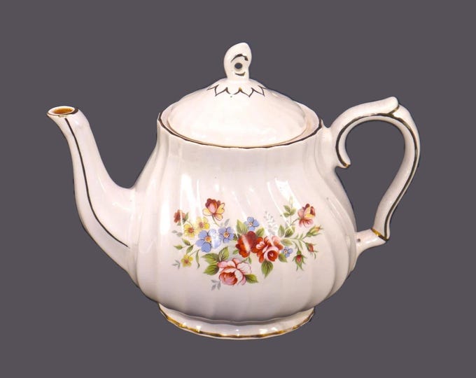 Sadler Windsor four-cup teapot. Roses and other multicolored flowers, gold edge and accents.