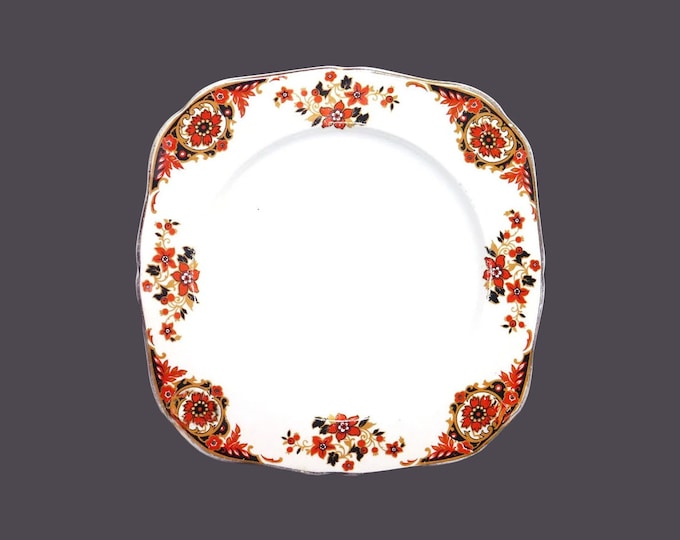 Hollinshead & Kirkham | HK Tunstall square luncheon plate made in England. Rust florals, scrolls, black accents.