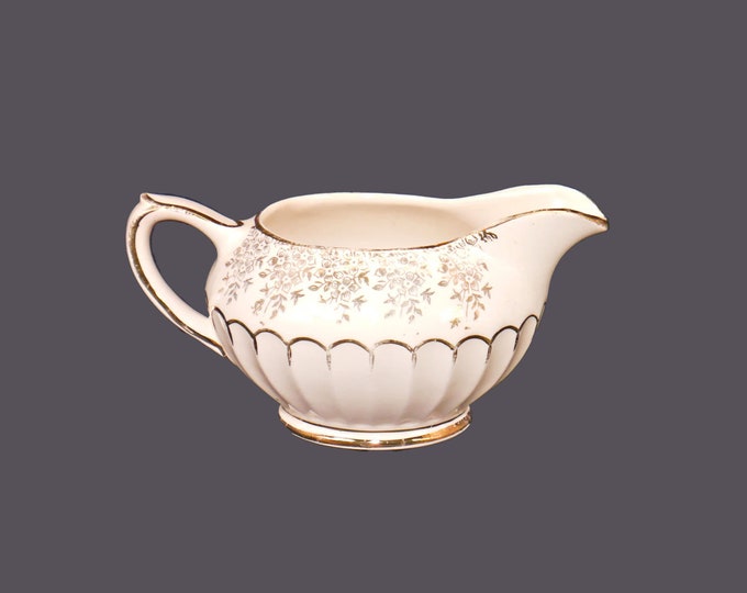Sadler 2476 hand-decorated creamer made in England. Flaw (see below).