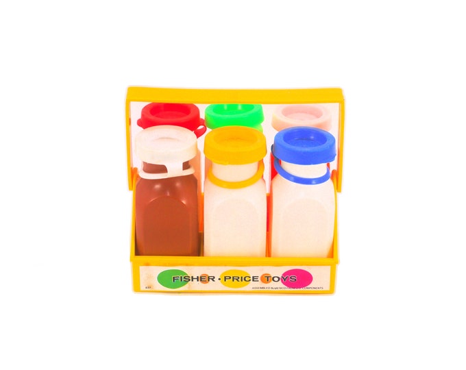 Fisher Price set of six milk bottles with multicolored lids in handled carrier.