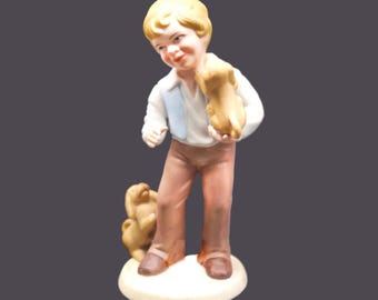 Avon Best Friends porcelain bisque figurine. Young boy with two dogs.