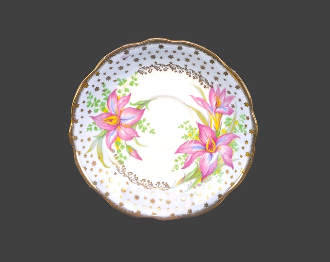 Foley orphaned saucer only. Robin's egg blue, pink iris florals, gold stars. Made in England.