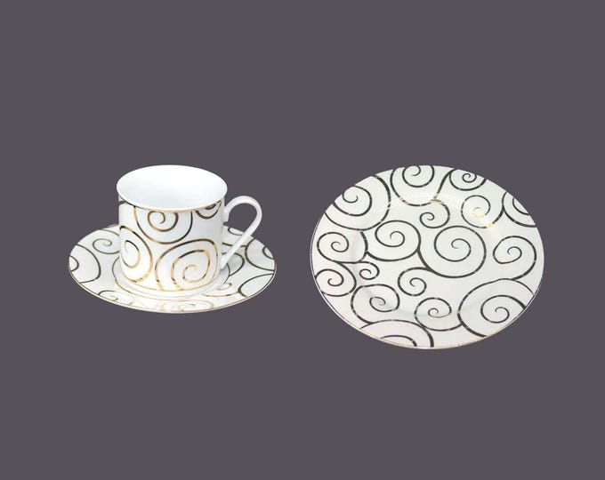 Pier 1 Gold Swirl Christmas trio of cup and saucer set and one salad plate.