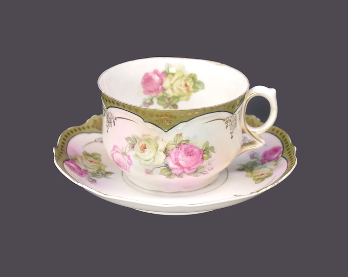 Antique PS Potschapel | Carl Thieme porcelain cup and saucer set made in Bavaria. Roses, green band, embossed gold dots. Flaws (see below).