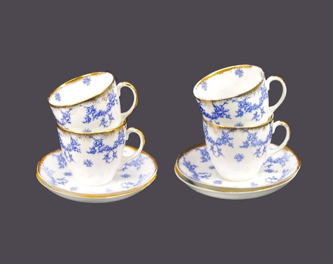 Four antique art-nouveau Regent China Ibis cup and saucer sets. Flow-blue bone china made in England. Flaw.